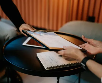 Two persons sharing a curriculum.